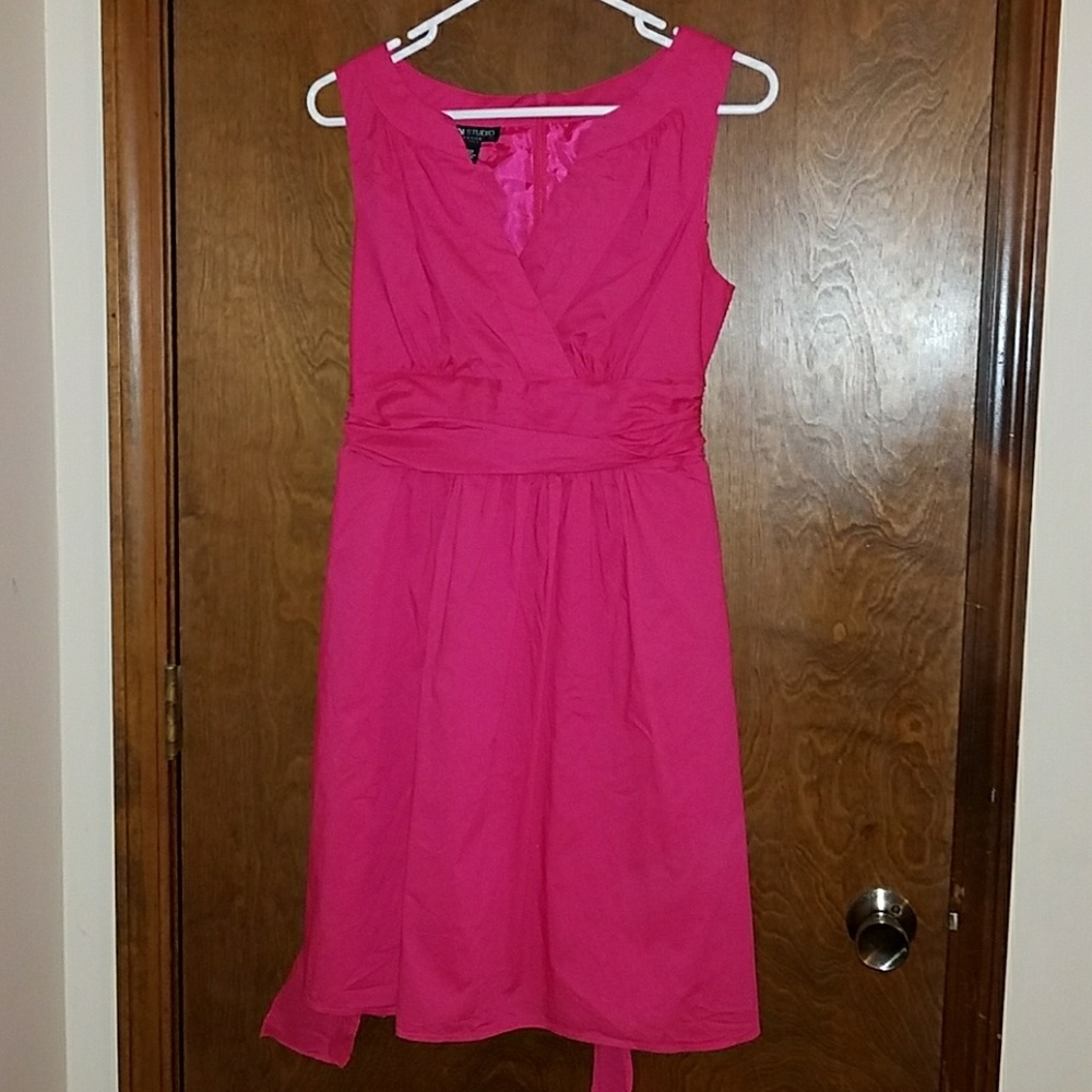Pink dress with tie back detail.